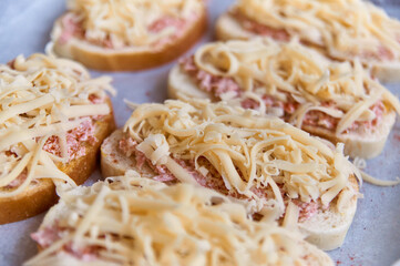 homemade open faced hot sandwiches with sausage and cheese