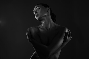 Female silhouette, beautiful woman in dark