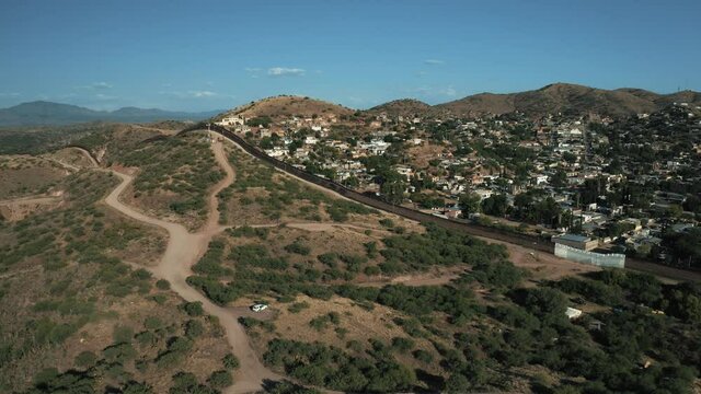 Aerial view of border city Nogales separating the United States of America and Mexico on a bright an sunny day with a drone