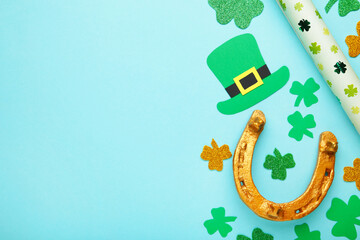 Green clovers and gold horseshoe on blue background for St. Patrick's Day Holiday.
