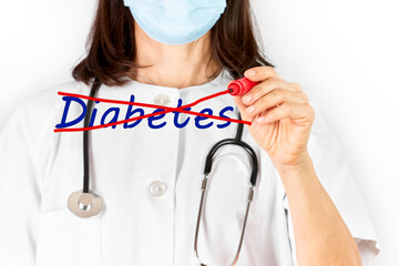 Doctor with mask crossing out the word diabetes with a red marker