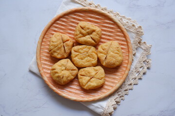 fried tofu in a plate against white background