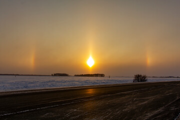 Solar optical halo effect in the early morning. The concept of studying the environment.