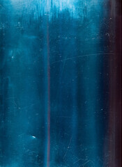 Distressed overlay. Dust scratches texture. Blue weathered old film surface with dirt grain noise...