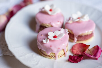 Fototapeta na wymiar pink sponge cake with flowers and petals wedding, valentine, spring, mothersday love cake 