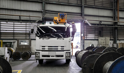 Car truck with loader to pick up steel wire scrap in factory