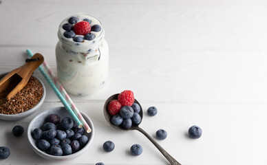 Portion of flax seeds in a small bowl. Healthy super foods flax seeds in a bowl mixed with yoghurt ready to eat. These seed are very healthy and can be eaten with a variety of different dishes.