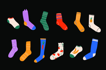 Vector collection of modern stylish cotton and woolen socks with different colored textures. Funny apparel illustration. Clothing design elements set. Items bundle on a dark background