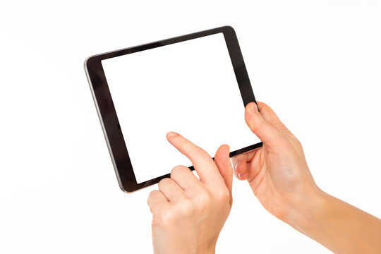 Tablet with a blank screen in hands of a woman. Girls hands with tablet computer. Digital tablet with white screen. Concept - place to advertise application on a gadget screen. Using digital gadgets