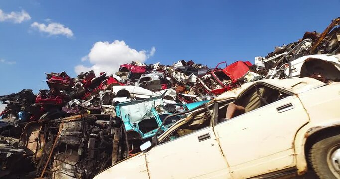 Cars Scrapyard Facility, Massive Heap of Wrecked Automobiles on Sunny Day