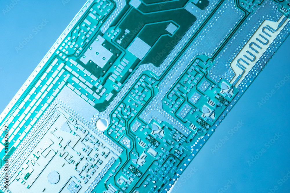 Poster microboard on a blue background. fragment of a microboard without copper elements. computer board wi