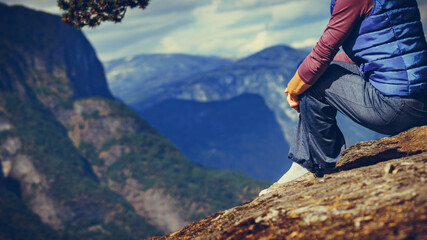 Naklejka premium Tourist on mountains top, Norway