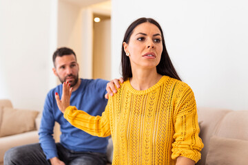 Husband apologizes to wife for treason. Repentant man hope for forgiveness from sad pensive woman....