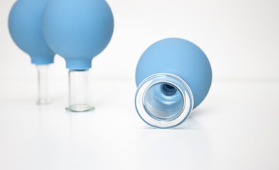 Massage jars on a white background.  Large diameters. Cupping vacuum massage of the face and body.