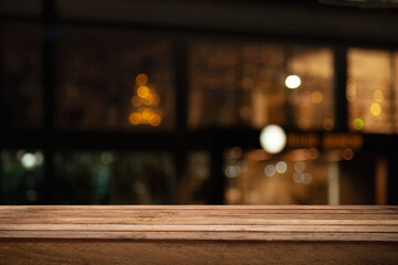empty table to showcase your product, against the background of a blurred cafe golden bokeh