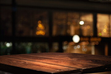 empty table to showcase your product, against the background of a blurred cafe golden bokeh