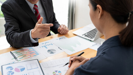 business professionals sitting around table meeting colleagues working together brainstorming on project discussing and planning concept at office