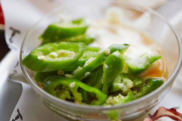 Thinly sliced  pepper in a bowl