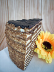 A slice of chocolate spartak cake or chocolate honey cake. Selective focus points. Blurred...