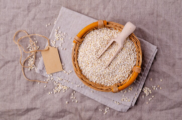 Dry pearl barley in a wicker basket