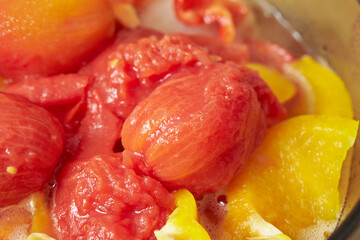 Vegetable soup mixed with peeled tomatoes