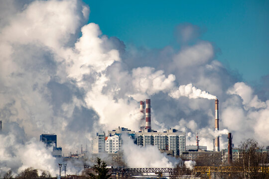 Smoke from a factory over residential areas.