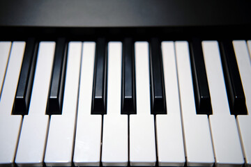 Black and white electronic piano keys, new modern synthesizer close-up