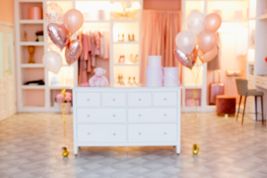 Defocusing Bathroom Dressing Room, Panic Room, Clothes Rack In Pink And Peach Colors With Balloons.