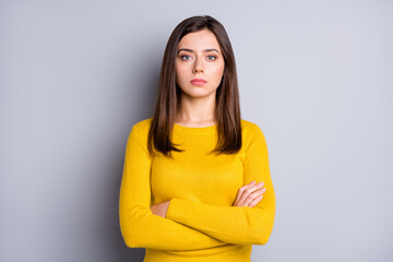 Portrait of strict brunette nice lady crossed arms wear yellow sweater isolated on grey color background