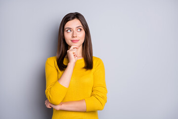 Photo of young attractive thoughtful minded pretty lovely girl thinking look copyspace isolated on...