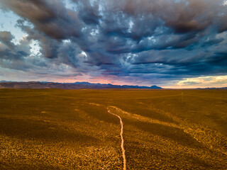 Aerial view of sunset rain river after thunderstorm over the arid Karoo, N12 highway, South Africa