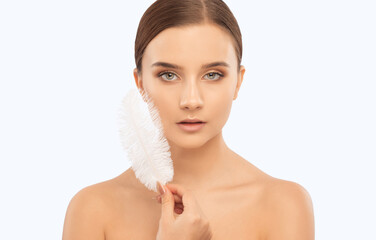 Portrait of a beautiful brunette girl with healthy clean skin and fresh make-up. Aesthetic...