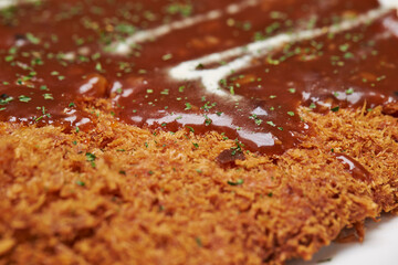 Delicious sauce over homemade pork cutlet