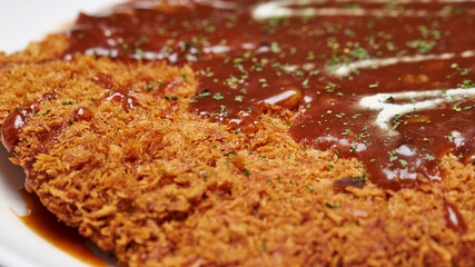 Delicious sauce over homemade pork cutlet