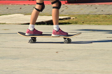 Fototapeta na wymiar young girl running on roller skates