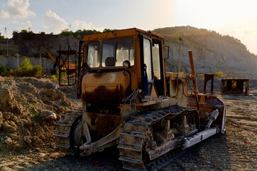 Fototapeta na wymiar excavation truck excavator gravel sand blue sky sun summer construction work