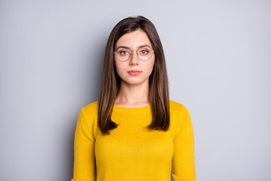 Portrait of attractive calm content girl wearing specs isolated over grey color background
