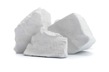 natural chalk crushed in large chunks on a white isolated background