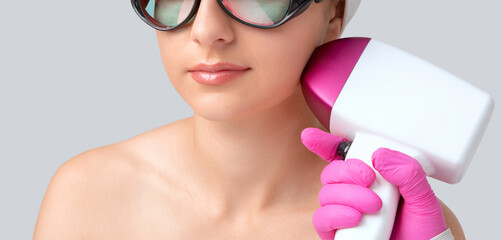 Elos epilation hair removal procedure on the face of a woman. Beautician doing laser rejuvenation...