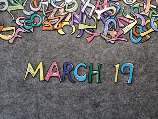 March 19 Calendar Keywords Hand-drawn colorful puzzle with grey furry background top view good for thumbnails