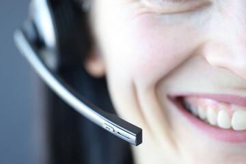 Smiling woman with microphone. Professions for remote work as an operator in call center