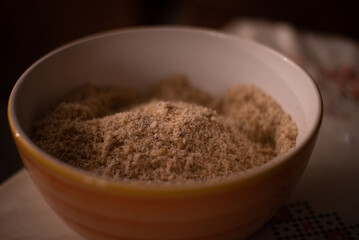 a bowl of ground walnuts. ingredients placed on the table ready to be put in cakes