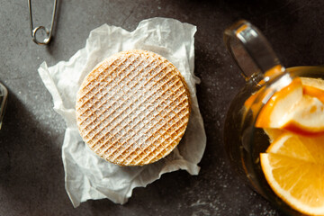 Viennese waffles on a black background. sweet table concept. Sweets for tea.