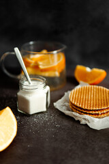 Viennese waffles on a black background. sweet table concept. Sweets for tea.