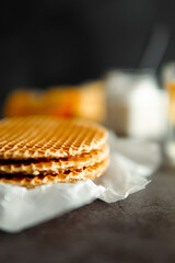 Viennese waffles on a black background. sweet table concept. Sweets for tea.