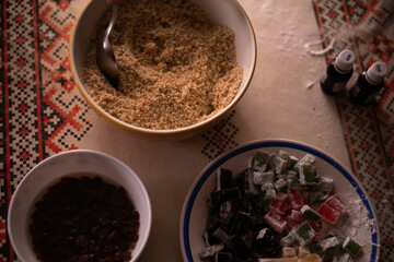 a bowl of ground walnuts. ingredients placed on the table ready to be put in cakes
