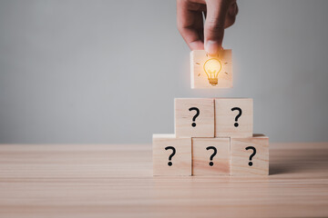 Idea wood block Concept. hand holding block Stacked together and then have Symbolic question Is to...