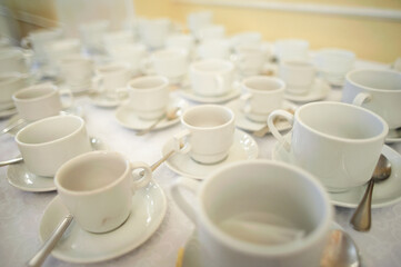 Many white clean coffee cups on table