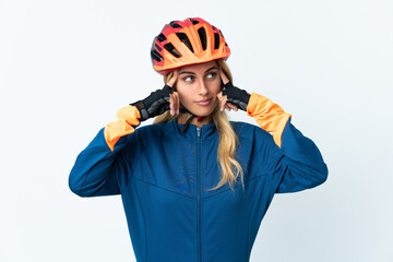 Young blonde Uruguayan cyclist woman isolated on background having doubts and thinking