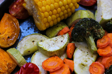 The background of super tasty, juicy, colorful oven roasted vegetables, super healthy! Close-up, top view